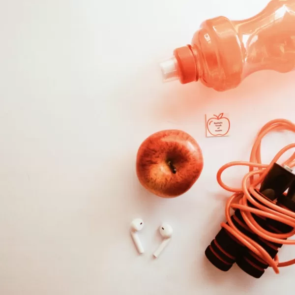 Unlock Your Nutrition & Fitness Journey: Essential Tools for Success - Apple, Skipping Rope, and Water Bottle - Integral Components of our 12-Week Nutrition and Fitness Program for Weight Loss. Start your transformation today!